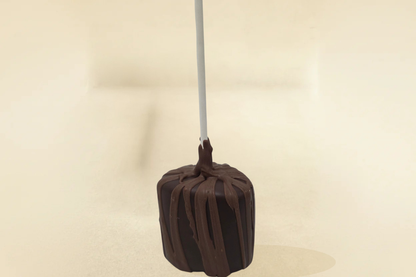 Dark chocolate marshmallow  pop with milk drizzle