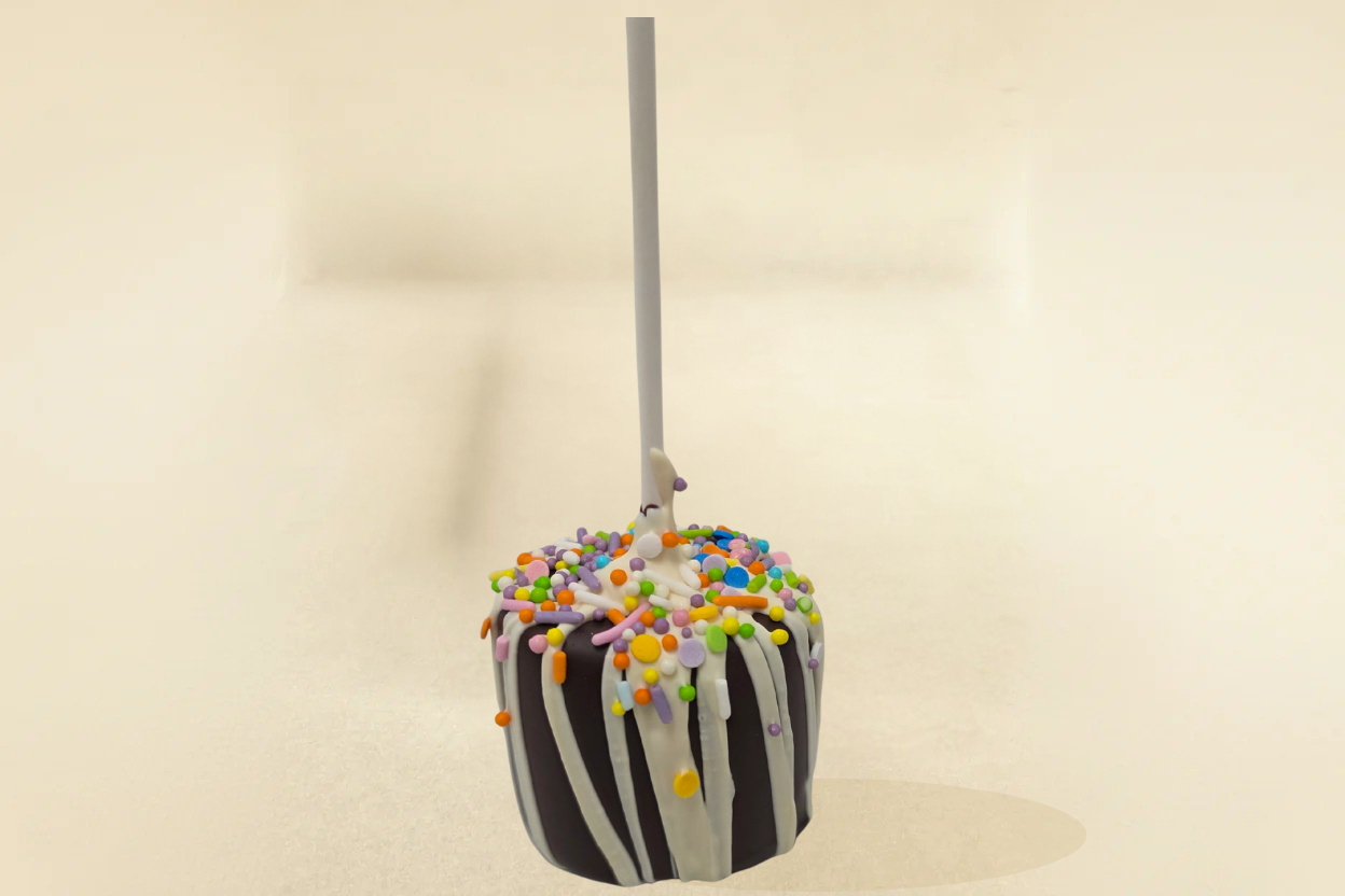 Dark Chocolate marshmallow pop with white drizzle and sprinkles