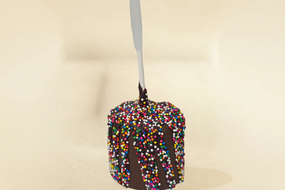milk chocolate marshmallow pop with milk drizzle and sprinkles