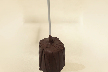 Milk chocolate marshmallow pop with milk drizzle