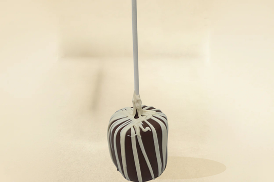Milk chocolate marshmallow pop with white drizzle